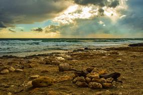 Coast Stones on the beach in cloudy twilight