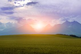 photo of a green field against the background of mountains in Slovakia