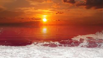 orange twilight over the sea foam of the surf