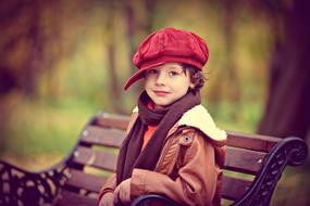 Autumn Child In Park red hat