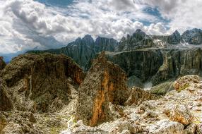 white clouds over the dolomites