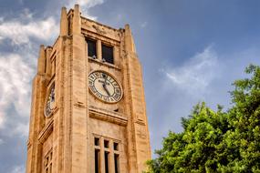 Tower Clock green busj blue sky