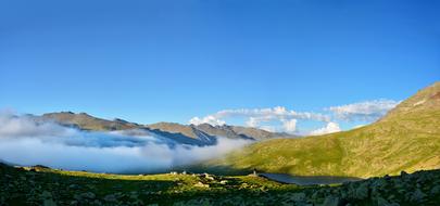Beautiful landscape of the colorful KaÃ§kars mountains with white clouds, at blue sky, in Turkey