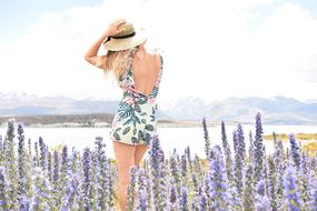 girl on the field with purple flowers