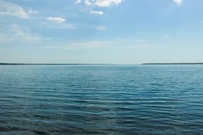 Beautiful waterscape with the blue water with ripple