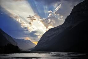 Sunbeam over Lake and Mountains