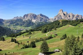 huts in valley at mountains, scenic summer Landscape