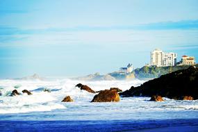 Beautiful landscape of the beach, with the rocks and building, in Biarritz, France