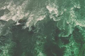 green ocean water with waves