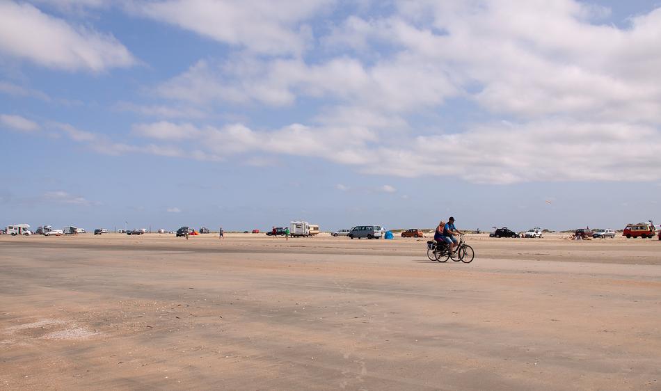 people cycling down the road