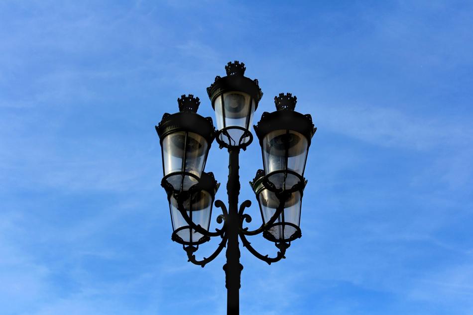 street lamp against a blue sky