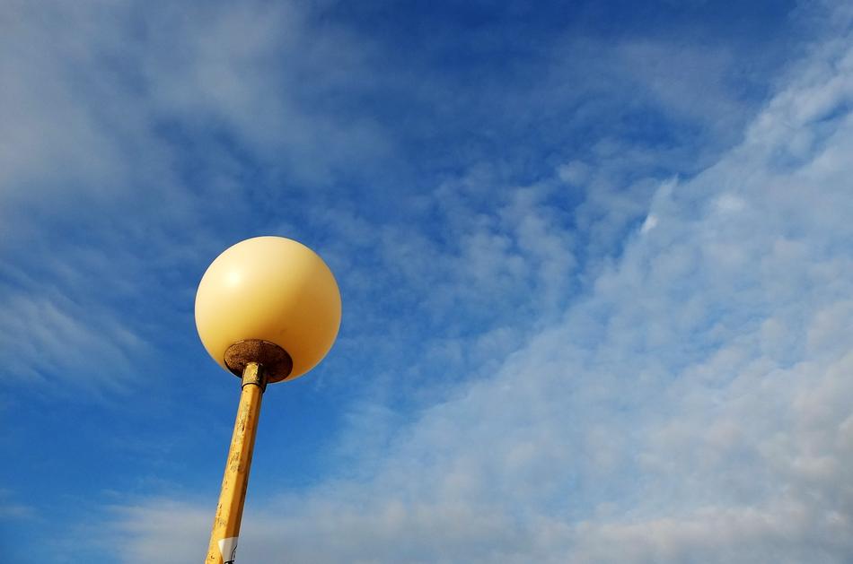 yellow lantern against the clouds
