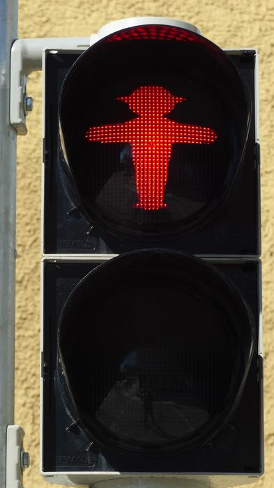 red light at the traffic on the road