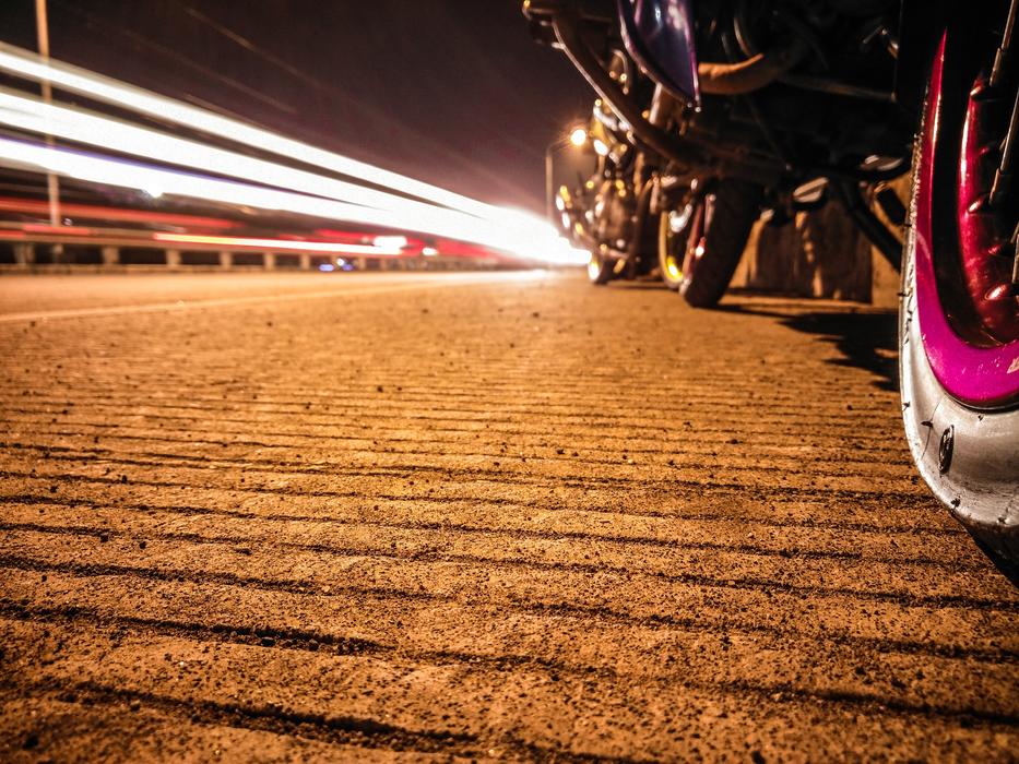 street light on the road with a motorcycle