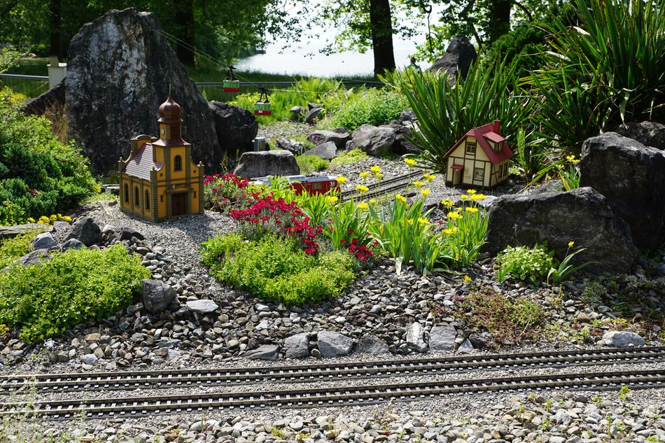 miniature houses near the railroad