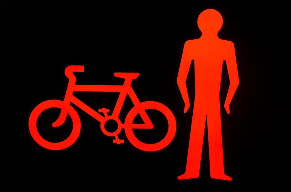 bicycle and male silhouette, red drawing at black background