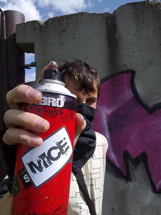 a man with a canister in his hand