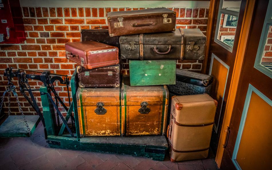 folded old suitcases at the entrance