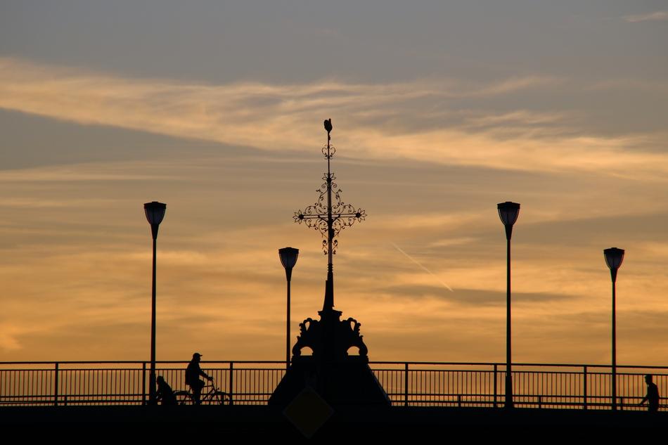 Silhouette of Frankfurt Bridge at beautiful and colorful sunset