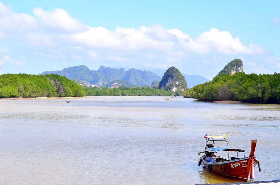 Boat on the water among colorful nature in Krabi, Thailand