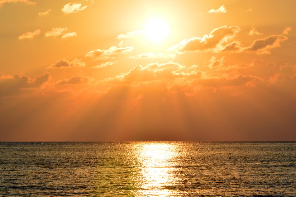 landscape of the golden Sunset above glossy sea