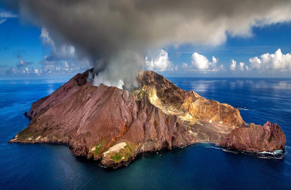 Beautiful and colorful volcano on the White Island, among the blue water, in New Zealand
