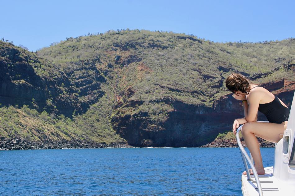 Wonderful view with the girl on the boat looking on the shore