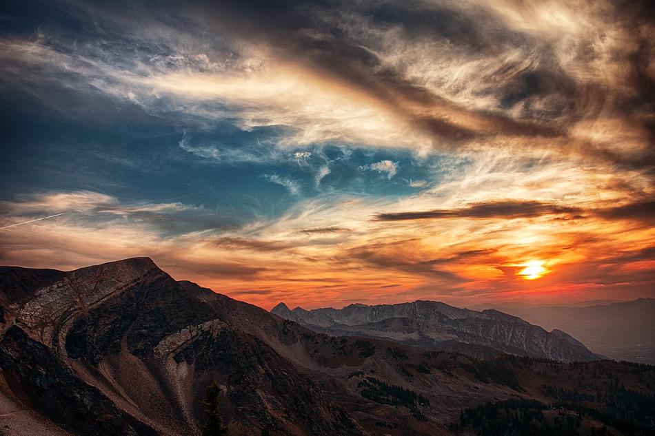Beautiful, green mountain, at colorful sunset in clouds, in Utah, USA