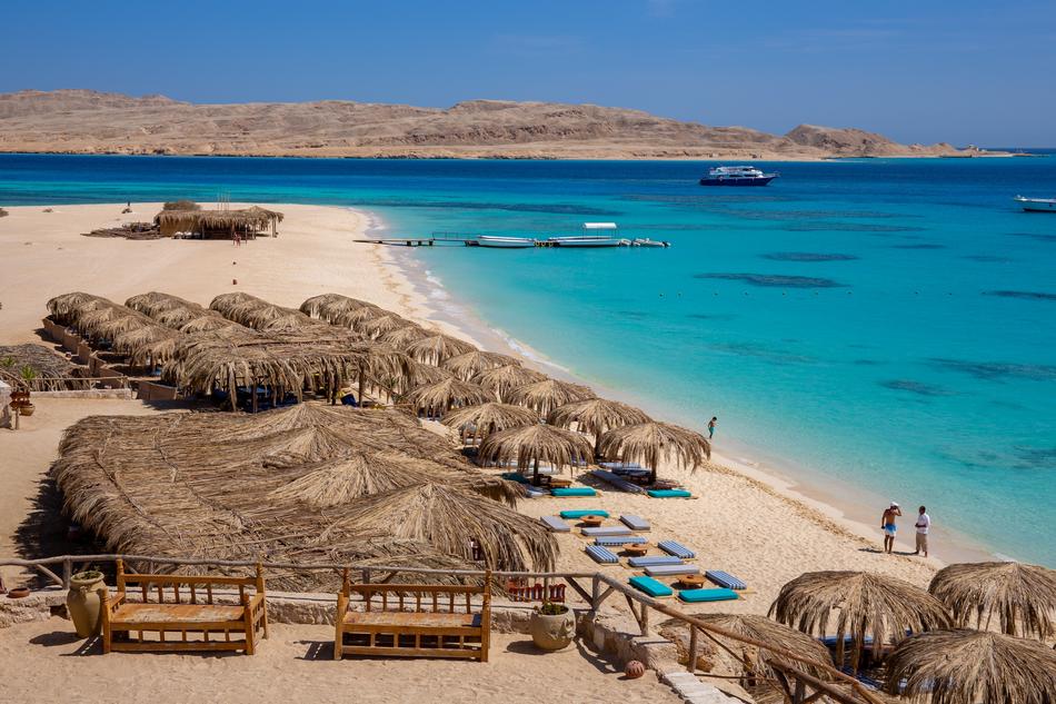 Mahmya with people. on the beautiful, sandy beach in Egypt