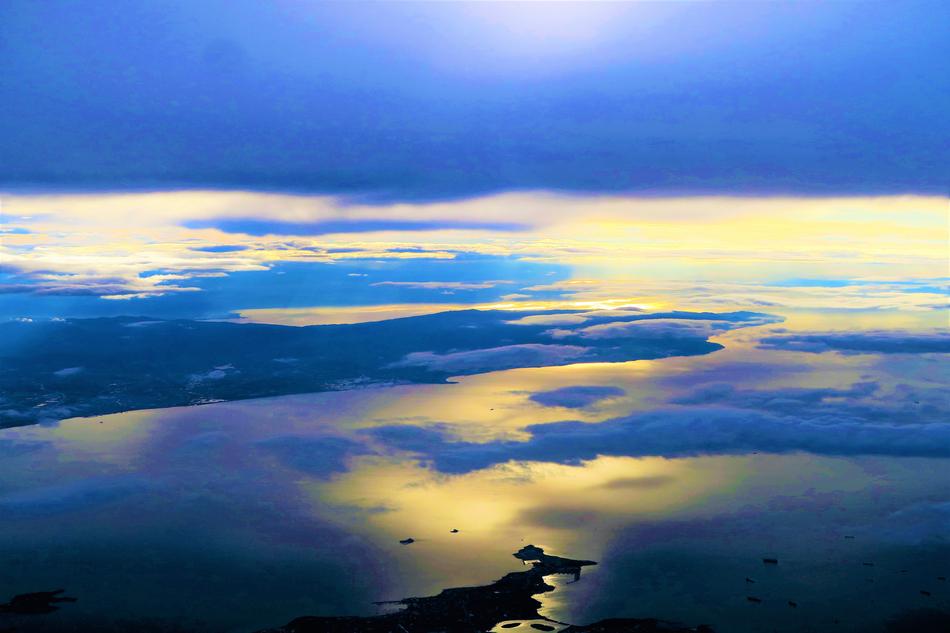 mirror reflection of clouds in the sea
