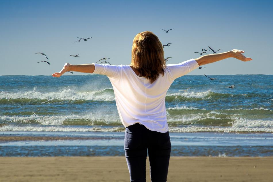 summer Vacations, concept, back view of girl in front of ocean