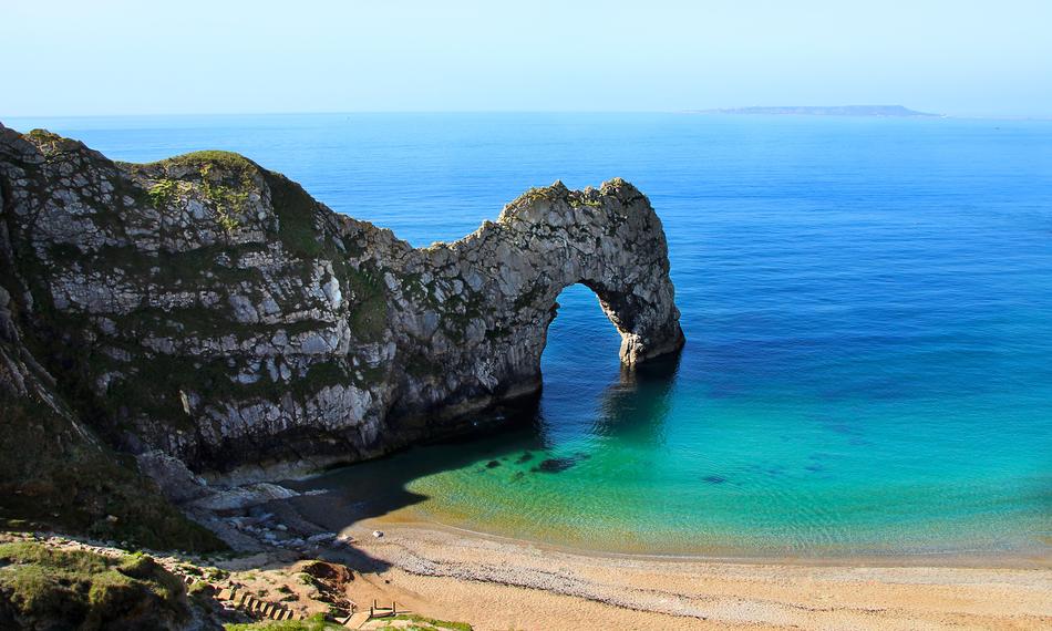 Beautiful and colorful Durdle Door, in the colorful sea in Cornwall, England, United Kingdom