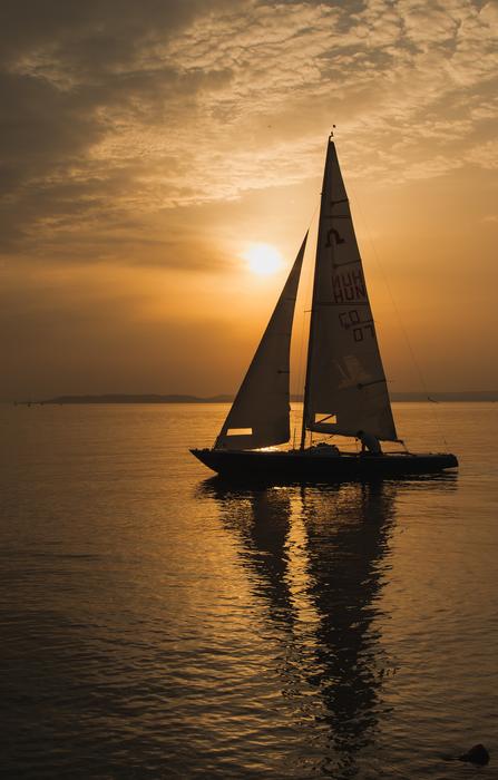 Sailing Boat at Sunset in Summer
