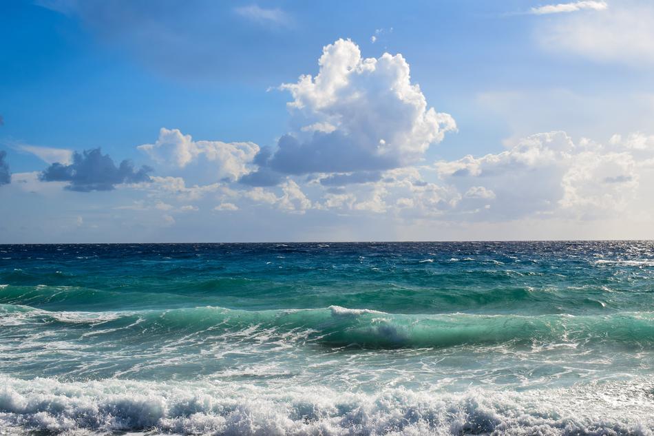Beautiful colorful seascape under the white and grey clouds