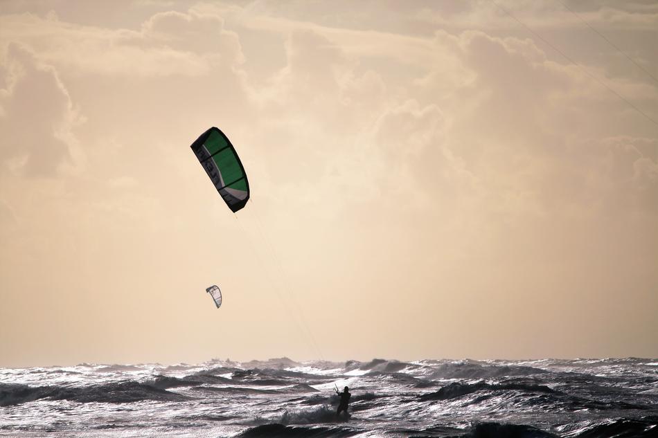Kitesurfing over the waves in Zandvoort, Netherlands
