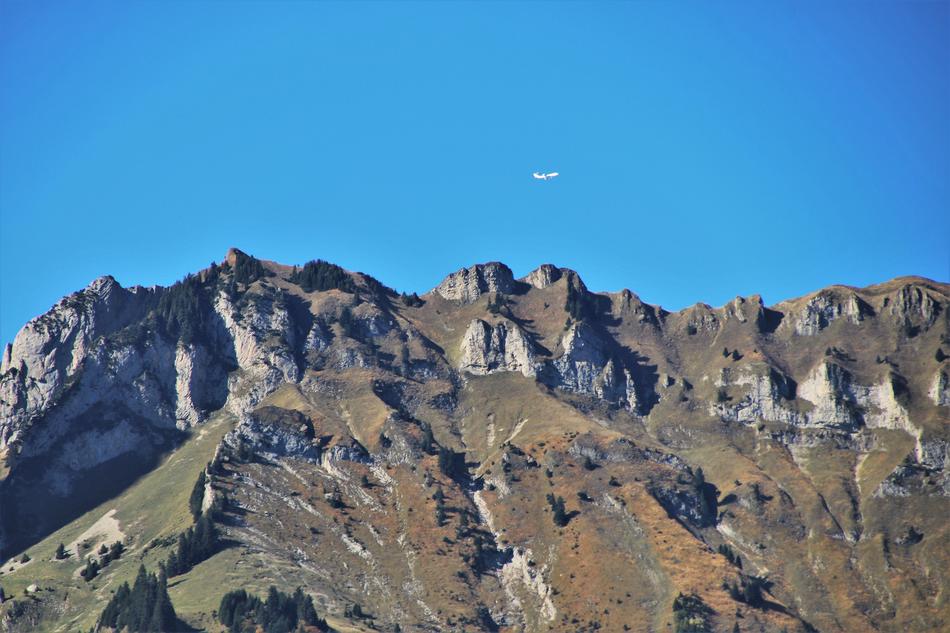plane over mountains in switzerland
