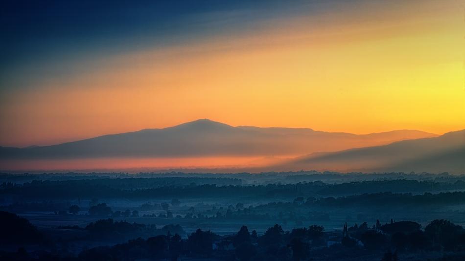 Beautiful panorama of the mountain in colorful dusk in Tuscany, Italy