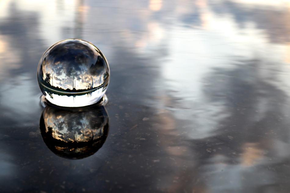 Beautiful crystal ball with reflections on the beautiful and colorful water