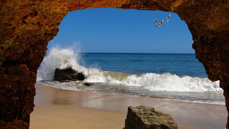 stone arch on the beach by the ocean