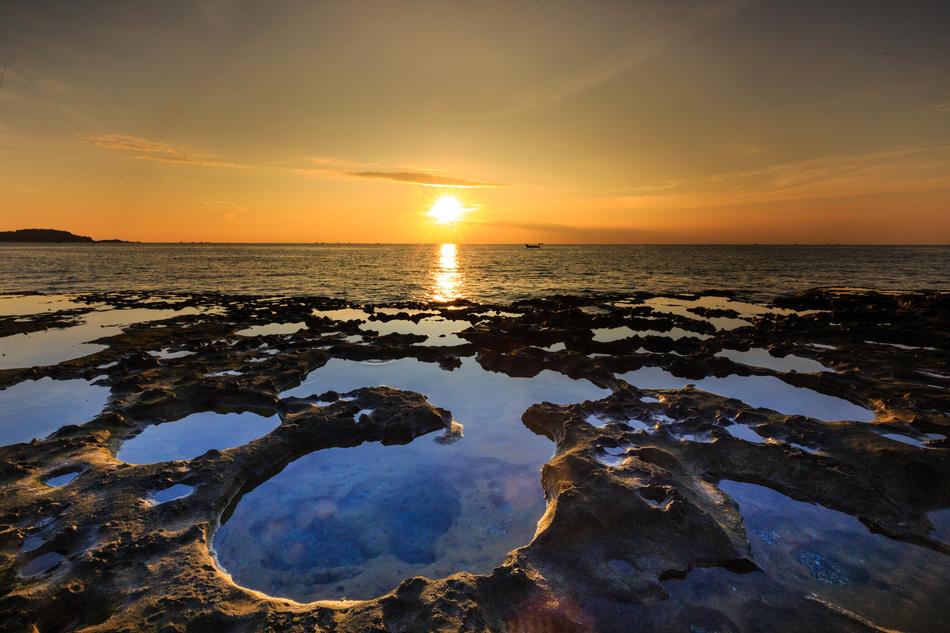 high tide on the coast at dusk