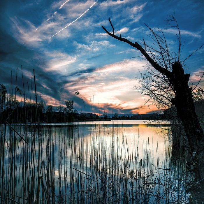 evening photo of the lake under the blue sky