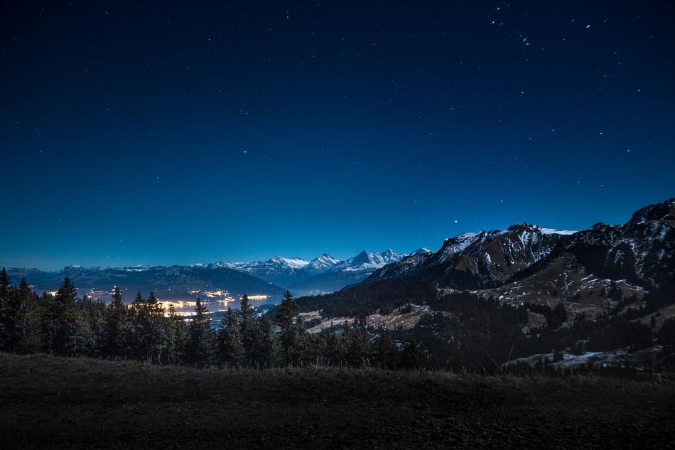 panoramic view of mountain landscape in blue twilight