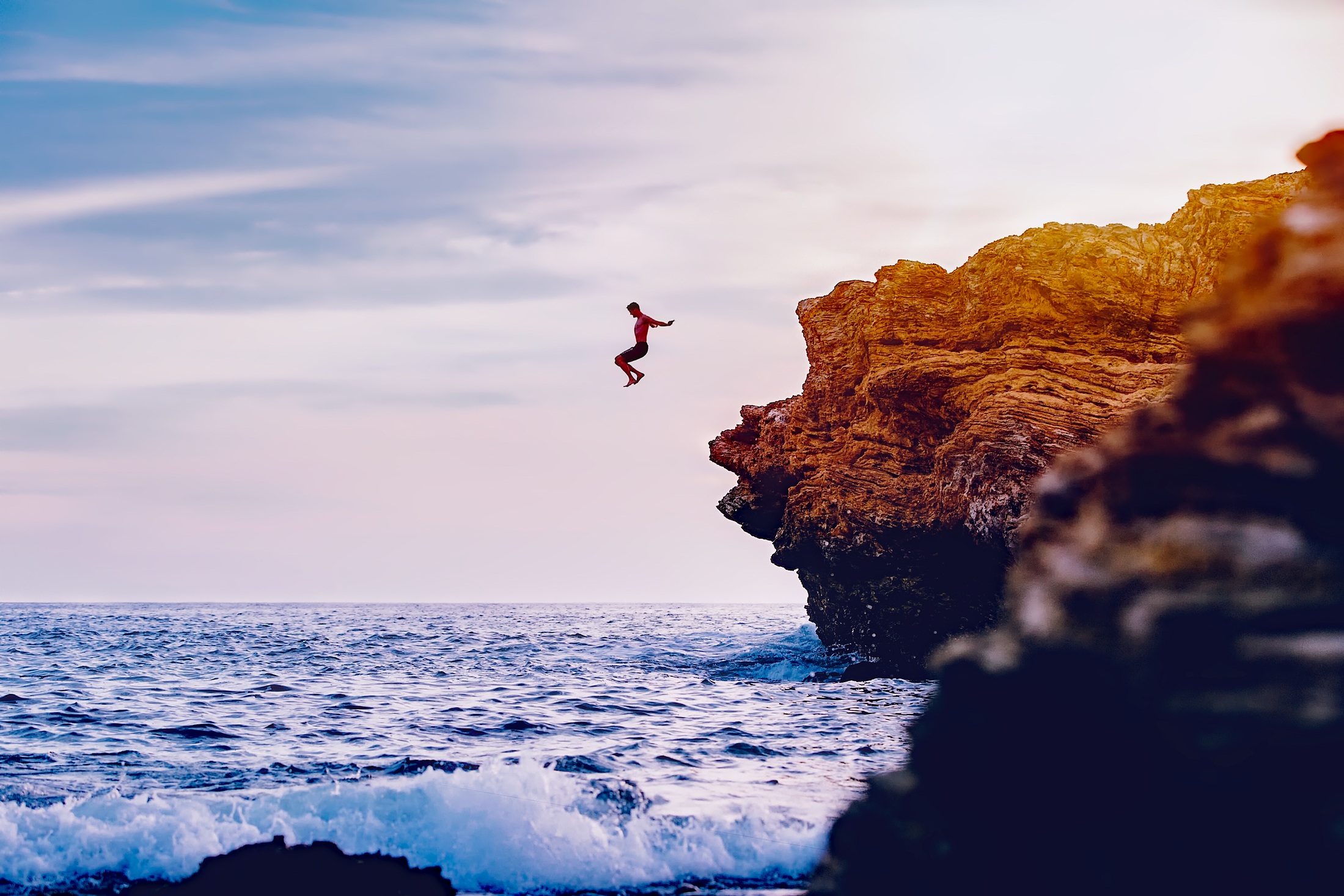 Man Jumping From Cliff To Ocean Usa California Free Image Download