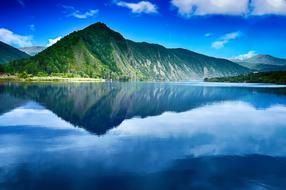 Beautiful, green mountains, around the beautiful lake, with the reflections