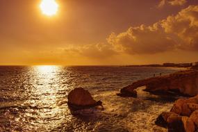 seashore with stones at dusk