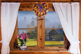 view from a wooden window on a picturesque autumn landscape