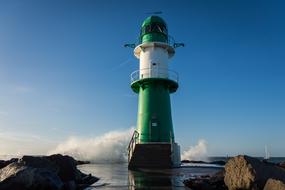 white-green lighthouse on the coast