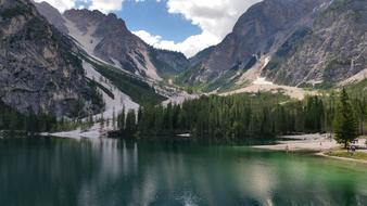 Beautiful Braies lake, among the green trees and mountains in Italy