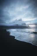 waves on the beach at night