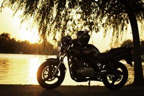 motorcycle on the lake at dusk